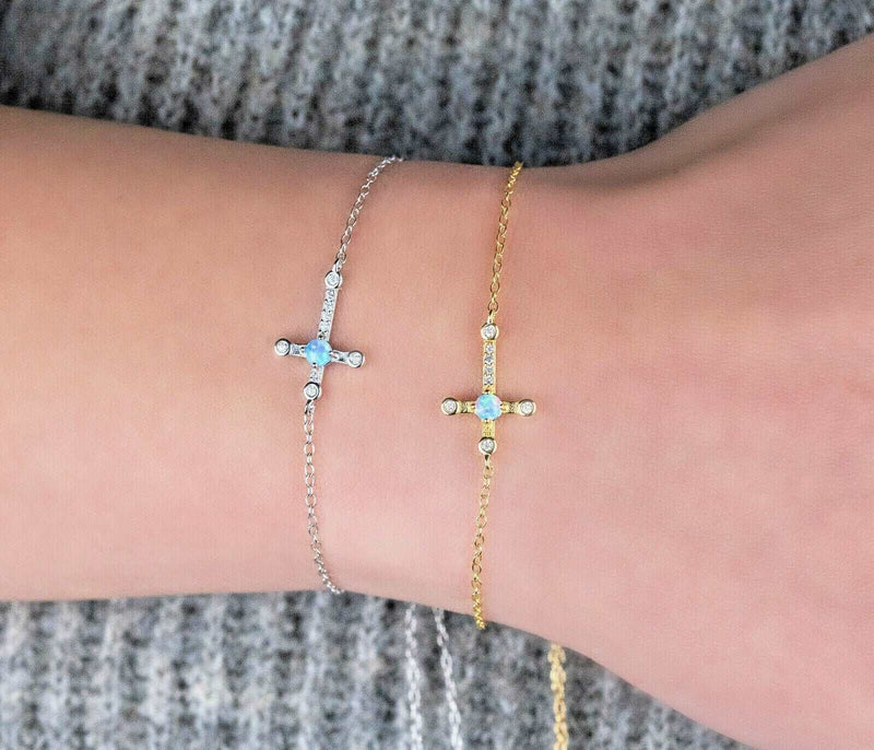 Sterling silver and gold-plated cross Jesus bracelets on wrist, classic 18K religious jewelry.