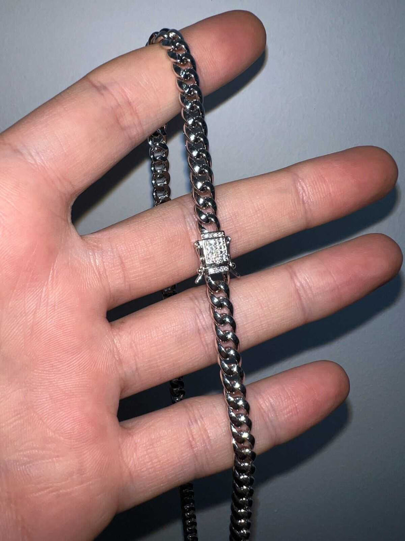 Men's moissanite Cuban curb link chain in solid 925 silver.