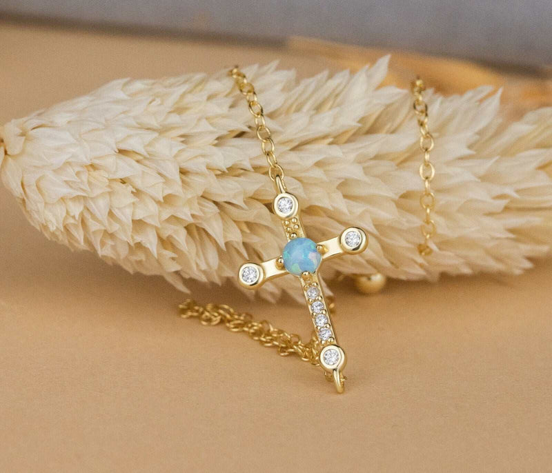 Sterling silver cross Jesus bracelet with 18K gold plating and cable chain design.