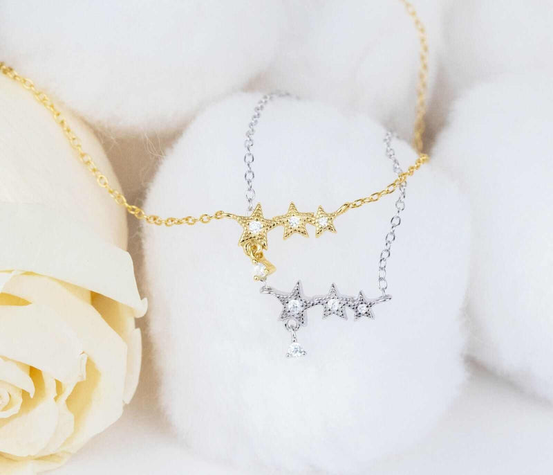 Stars bracelet in 925 sterling silver and 14K gold plated finish with tiny star charms and cubic zirconia.