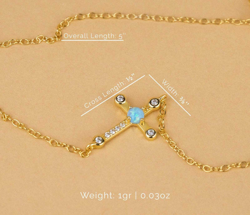 Sterling silver cross Jesus bracelet with 18K gold plating and opal detail.
