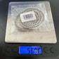 Men's Moissanite Real Cuban Curb Link Chain on scale showing 56 grams.