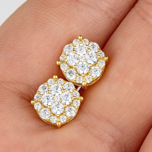 Men's 925 sterling silver 14K gold plated CZ hip hop earrings on hand background.