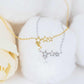 Stars bracelet in 925 sterling silver and 14K gold plated finish with tiny star charms and cubic zirconia.