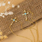 Sterling silver Jesus cross bracelet with 18K gold plating on burlap background.