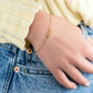 Delicate stars bracelet in 925 sterling silver with 14K gold plating on wrist.