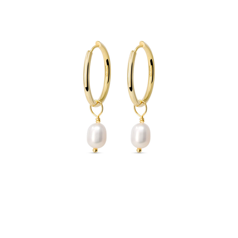 Gold huggie hoop earrings with freshwater pearl charms.