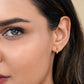 925 sterling silver Harmony Huggie Earrings with 14K gold finish and CZ stones.