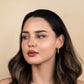 Mirage Twisted Hoop Earrings with 18k gold plating and hypoallergenic stainless steel.