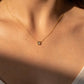 Nacre Flower Necklace with Mother-of-Pearl pendant on gold-dipped chain.