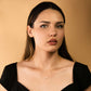 Minimalist pearl bead necklace on woman with black dress.