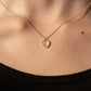 Seashell Serenity Necklace with heart-shaped mother of pearl pendant on 18K gold finish chain.