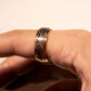 Rose gold tungsten carbide men's wedding band with hammered texture.