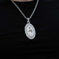 Solid 925 Sterling Silver Virgin Mary Pendant with Clear CZ Stones on Black Background.