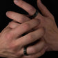 Pine Tree Forest Ring with tungsten band and forest etching on hand.