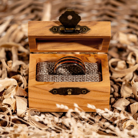 Tungsten and wood inlay Whiskey Barrel Ring in a wooden box.